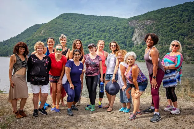 The circle sisters posing together on the riverbank